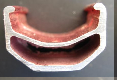 [Rim section showing worn brake track]
